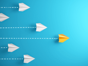 paper planes on blue background symbolizing leadership