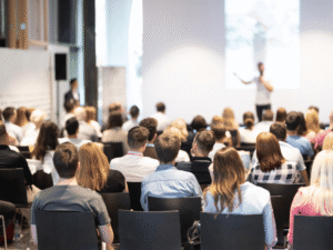 person speaking in front of audience