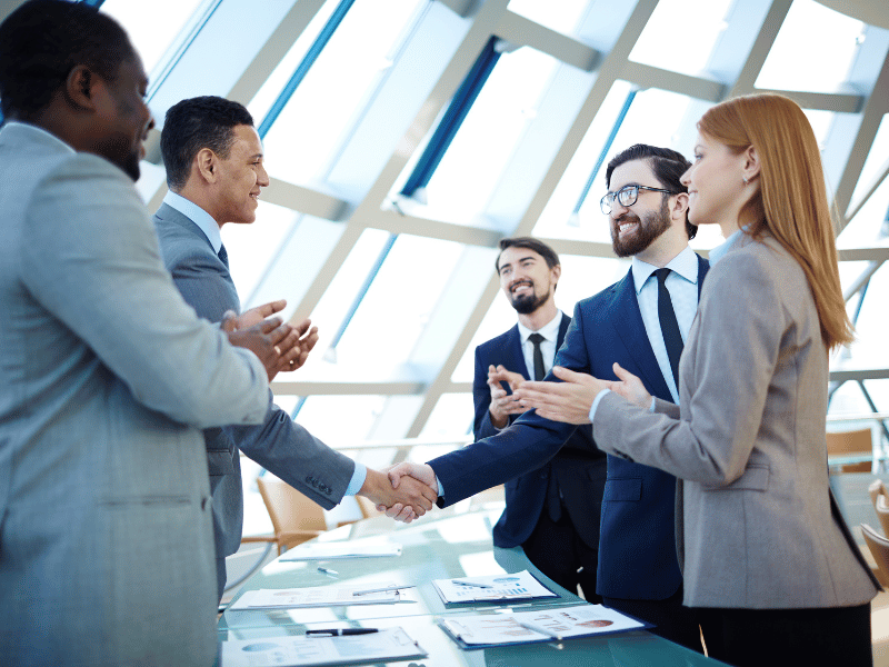 business people shaking hands after negotiation